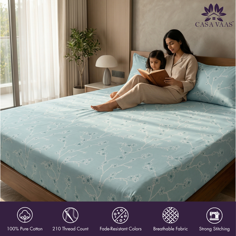 Woman and child reading on a bed with Casa Vaas bedding, featuring product features at the bottom.