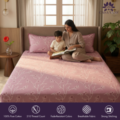 Woman and child reading on a bed with Casa Vaas bedding