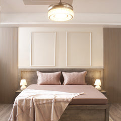 Modern bedroom with a bed, nightstands, and ceiling light fixture.