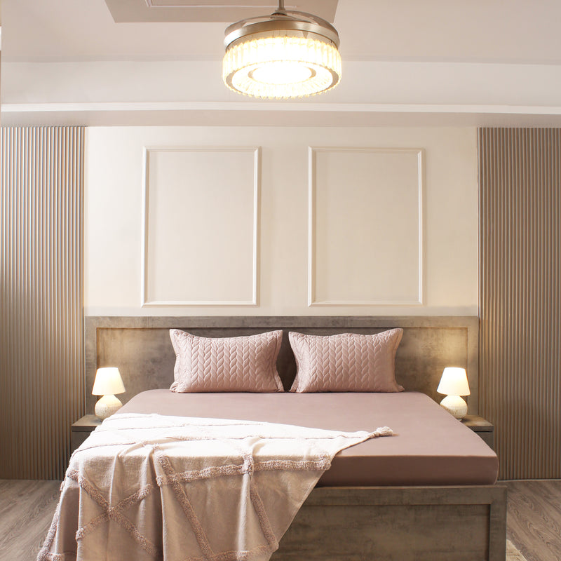 Modern bedroom with a bed, nightstands, and ceiling light fixture.