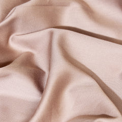 Close-up of beige fabric with folds