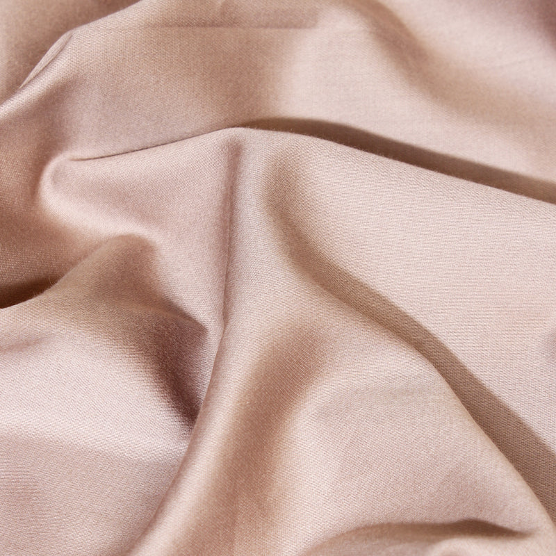 Close-up of beige fabric with folds