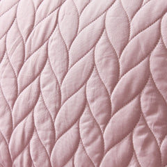 Close-up of pink quilted fabric texture