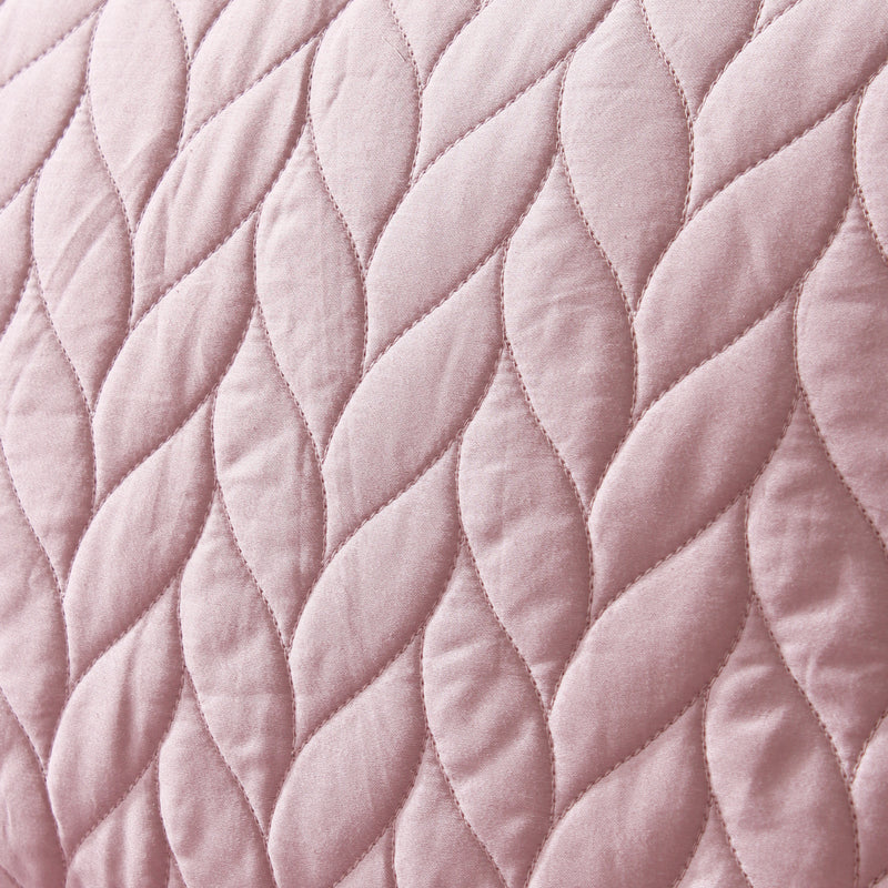 Close-up of pink quilted fabric texture