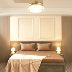 Modern bedroom with a bed, nightstands, and wall art.