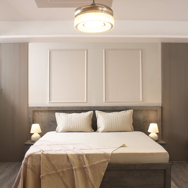 Modern bedroom with a bed, headboard, and ceiling light fixture.