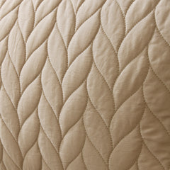 Close-up of beige quilted fabric texture