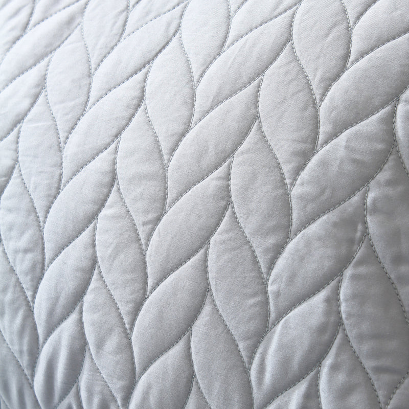 Close-up of a textured gray fabric with a diamond pattern