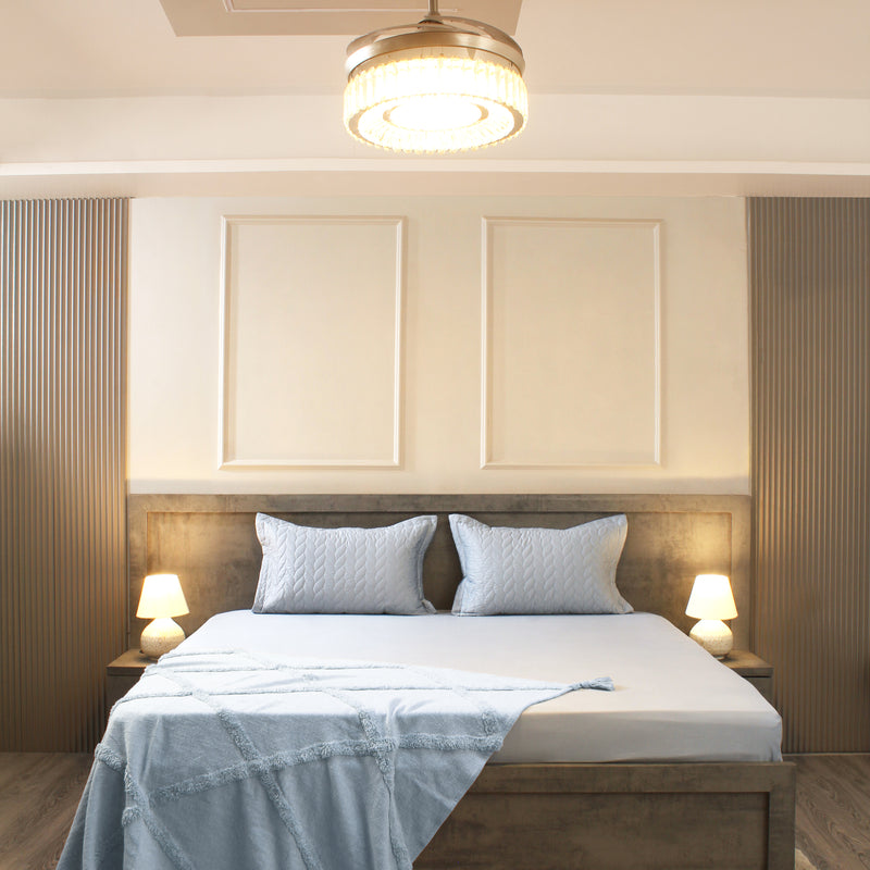 Modern bedroom with a bed, nightstands, and ceiling light fixture.