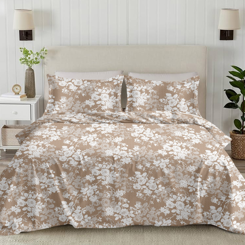 Floral duvet set on a bed in a bedroom with lamps and plants.