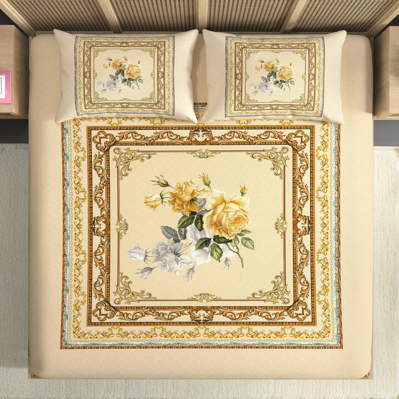 Decorative bedspread with floral design and intricate border on a bed.