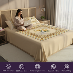 Woman using a laptop on an embroidered bedspread in a bedroom.