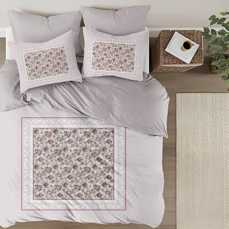 Floral patterned bedding set on a bed with a neutral color scheme.