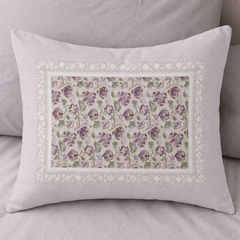 Decorative pillow with floral pattern on a gray background