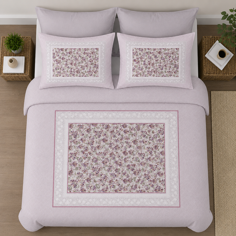 Floral patterned bedding set on a bed with decorative pillows.