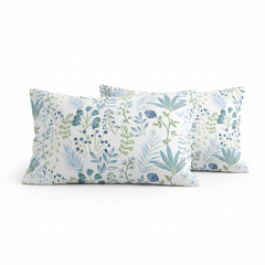 Two floral-patterned pillows on a white background
