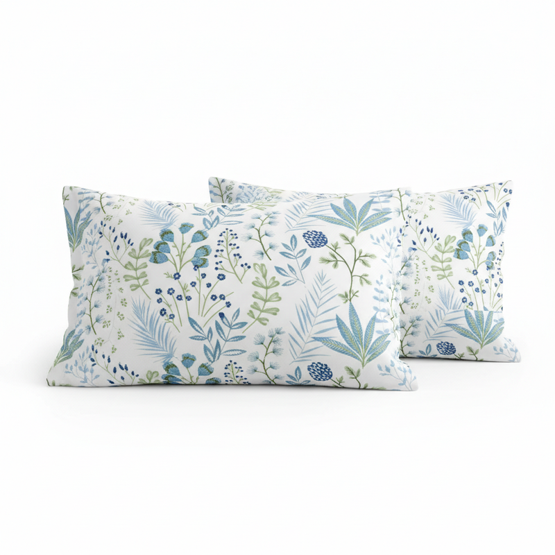 Two floral-patterned pillows on a white background