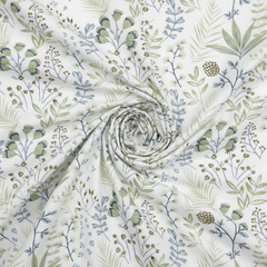 Floral fabric with green and blue patterns on a white background