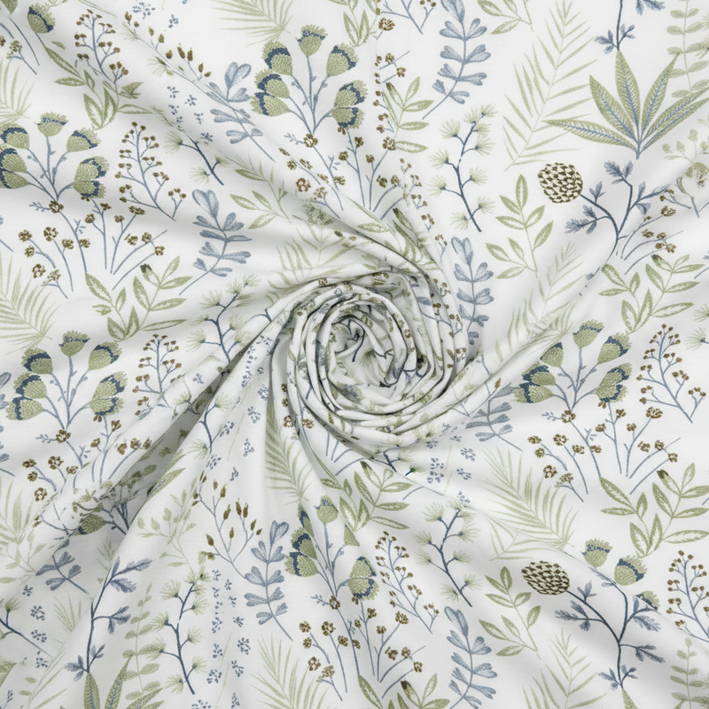 Floral fabric with green and blue patterns on a white background