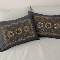 Decorative pillows with floral patterns on a bed