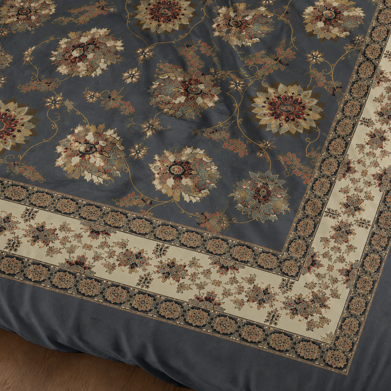 Close-up of a patterned rug with floral designs on a dark background