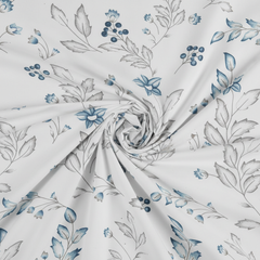Floral fabric pattern with blue flowers and green leaves on a white background