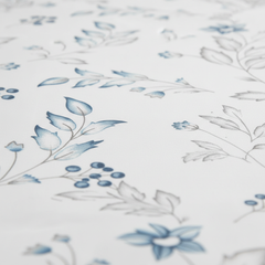 Floral pattern with blue flowers and leaves on a white background