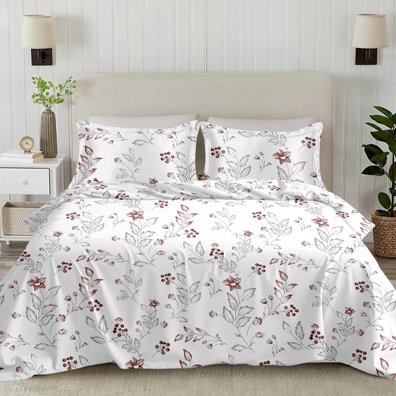 Floral patterned bedding set on a bed in a bedroom setting with lamps and plants.
