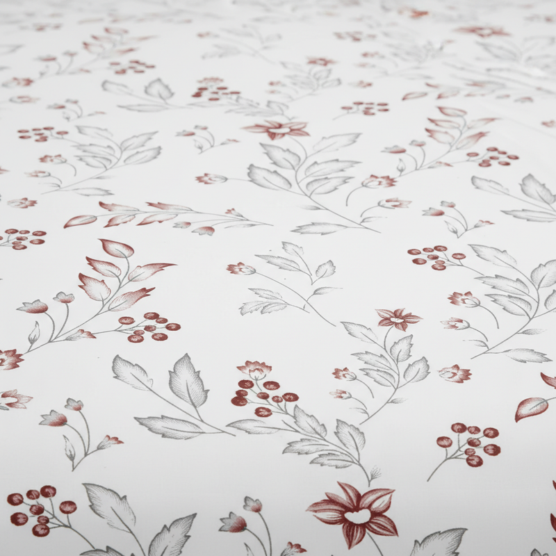 Floral patterned fabric with red and gray flowers on a white background