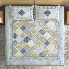 Decorative quilt with geometric pattern on a bed