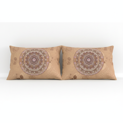 Two brown pillows with mandala patterns on a white background