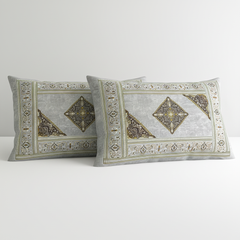 Two decorative pillows with intricate patterns on a white background