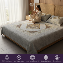 Woman sitting on a bed with a decorative quilt in a bedroom setting
