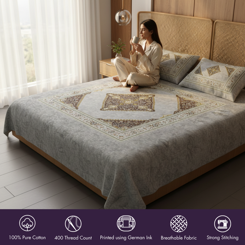 Woman sitting on a bed with a decorative quilt in a bedroom setting