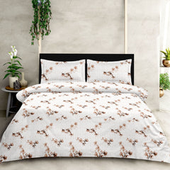 Floral patterned bedding set on a bed with a neutral background