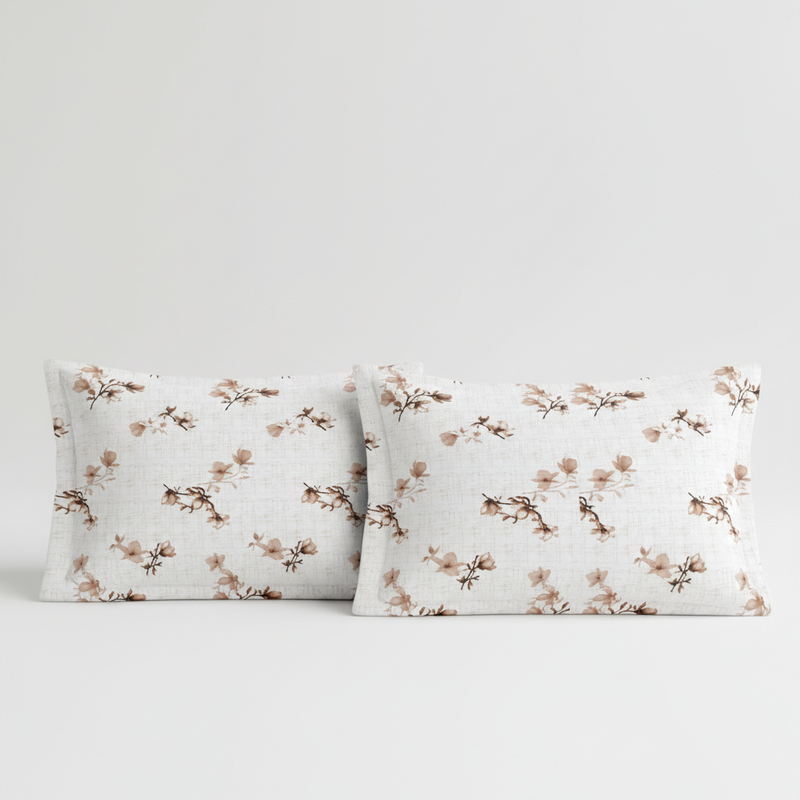 Two floral-patterned pillows on a light gray background