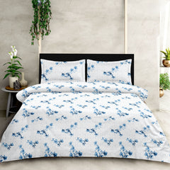 Floral patterned bedding set on a bed with a neutral background