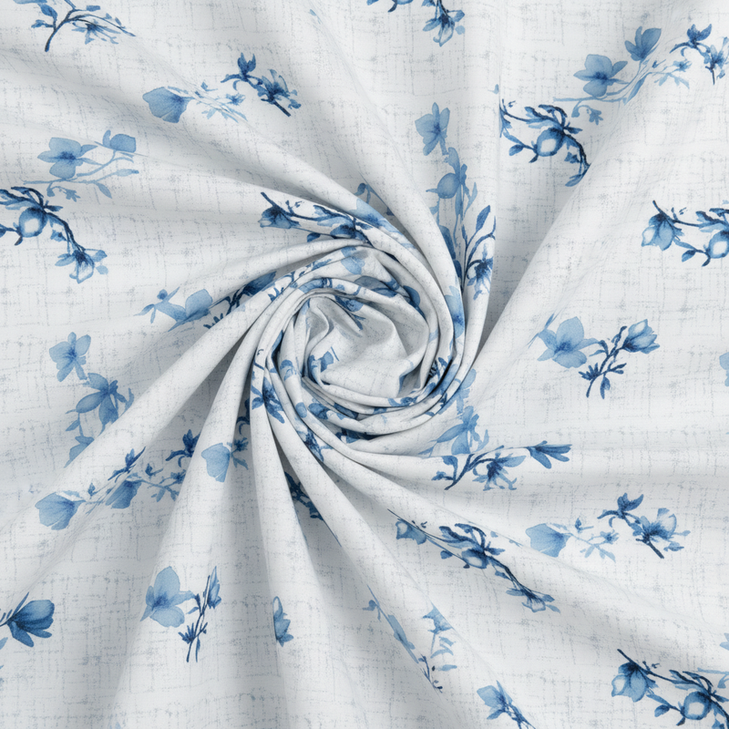 Rolled-up fabric with blue floral pattern on a white background