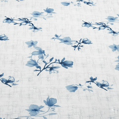 Blue floral pattern on a textured white background