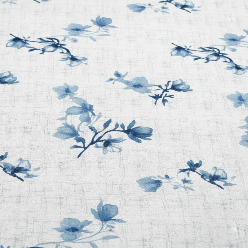 Blue floral pattern on a textured white background