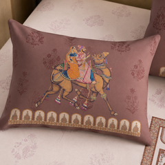 Decorative pillow with a horse and rider design on a floral background