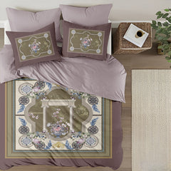 Decorative bedspread with floral patterns on a bed in a bedroom setting.