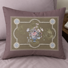 Decorative pillow with floral design on a matching background