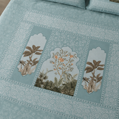 Embroidered floral patterns on a light blue fabric background