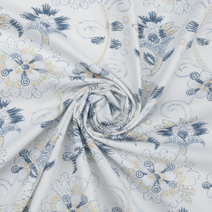 Floral patterned fabric with blue and yellow accents on a white background