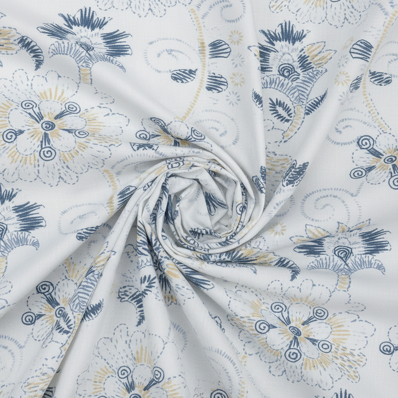 Floral patterned fabric with blue and yellow accents on a white background